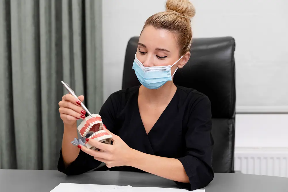 medium-shot-denstist-wearing-mask 1