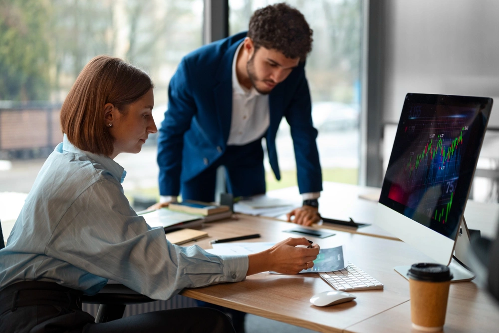 people-office-analyzing-checking-finance-graphs_1000x667